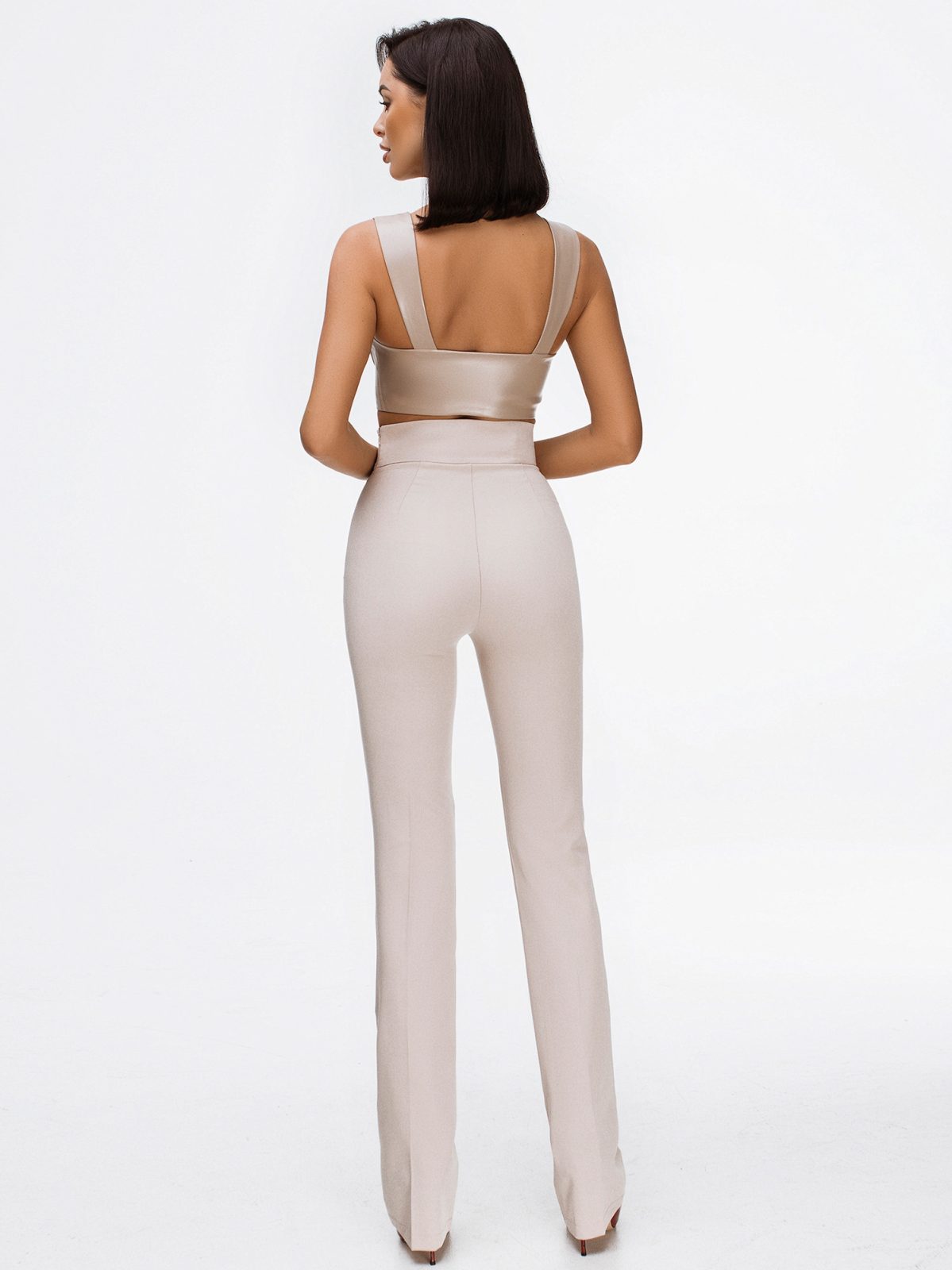 beige crop top and high waisted trousers